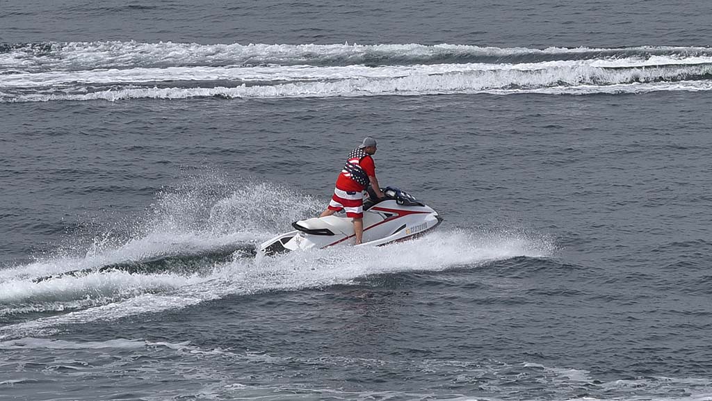A jet ski rider in patriot clothes takes a spin in San Diego Bay on Memorial Day.