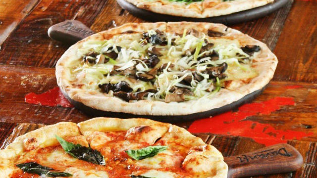 Pizzas at a restaurant in Little Italy