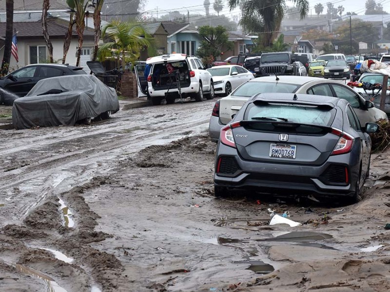 A river of storm water damages 42nd St. Photo by Chris Stone